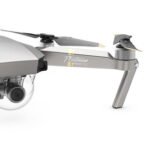 Close-up of a silver drone with a camera, labeled "Platinum Mavic Pro," featuring propellers and a 3-axis gimbal.