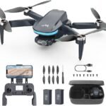 Drone kit with remote controller, smartphone holder, extra propellers, screwdriver, two batteries, charging cable, and a carrying case.