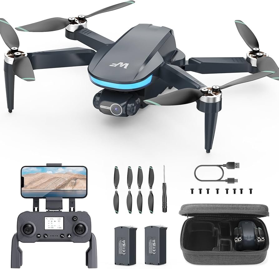 Drone kit with remote controller, smartphone holder, extra propellers, screwdriver, two batteries, charging cable, and a carrying case.