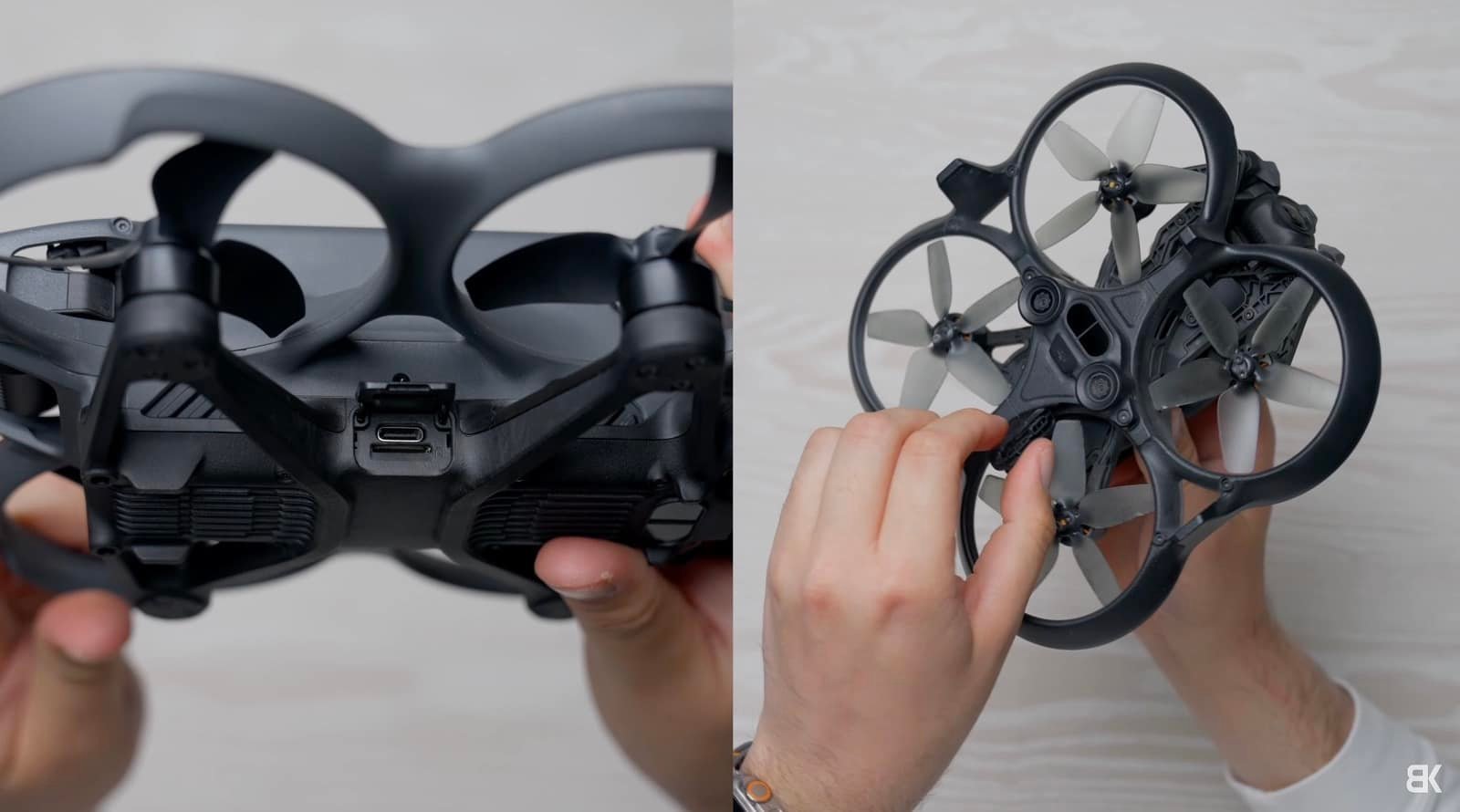 Close-up of a person holding a small quadcopter drone, showing the bottom view with propeller guards and USB port. The person's fingers are visible interacting with the drone parts.