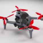 A drone with a gray body and red propellers is displayed against a neutral background.