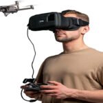 Person using VR headset and controller to fly a drone.