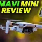 Image of a DJI Mavic Mini drone in flight with a text overlay saying "DJI Mavi Mini Review" and a small image of the controller.