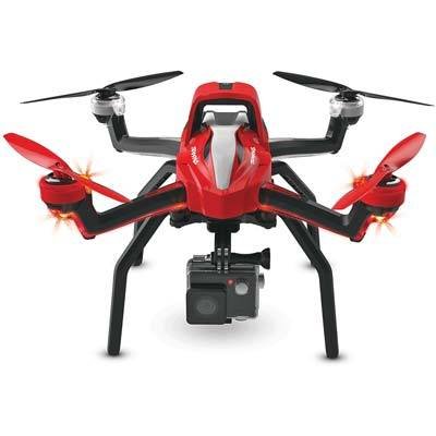 Red and black quadcopter drone with camera attached underneath, seen from the front on a white background.